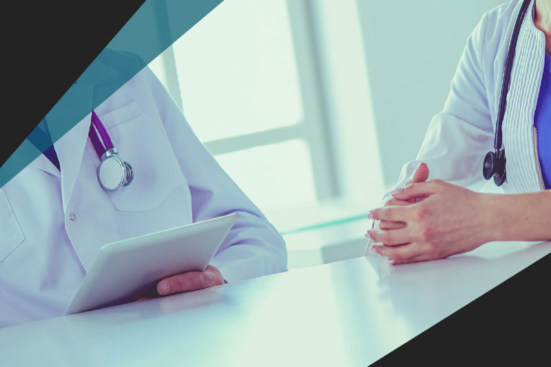 Two doctors discussing in office